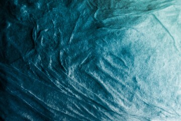 Blue green abstract background. Gradient. Toned cracked stone surface. Teal background for design.