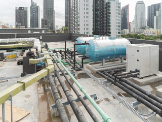 Chiller tower or cooling tower on rooftop of a office building in urban city. System work....