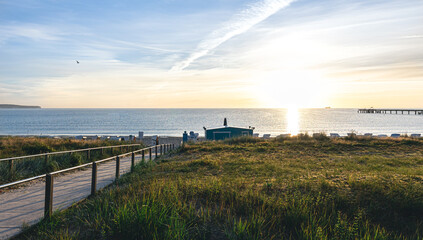 Sea embankment at sunset with a clear cloudless sky.