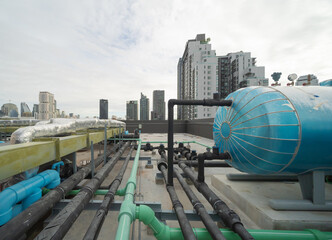 Chiller tower or cooling tower on rooftop of a office building in urban city. System work....