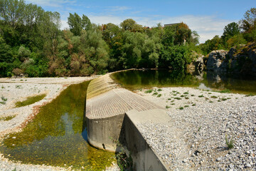 The Natisone river during the 2022 drought as it flows through the north east Italian village of...