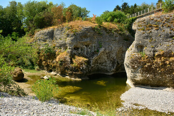 The Natisone river during the 2022 drought as it flows through the north east Italian village of Premariacco, Udine Province, Friuli-Venezia Giulia. Normally a very busy swimming spot during the summe