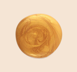 Empty cream gold glitter color drop on neutral beige background.