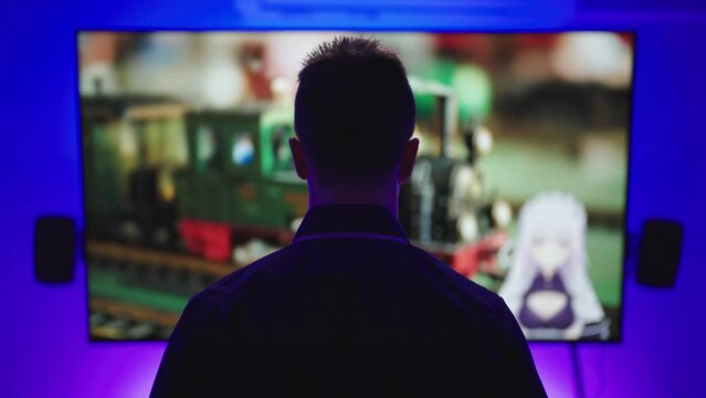 Male person silhouette watch anime vtuber stream on big television screen 4K