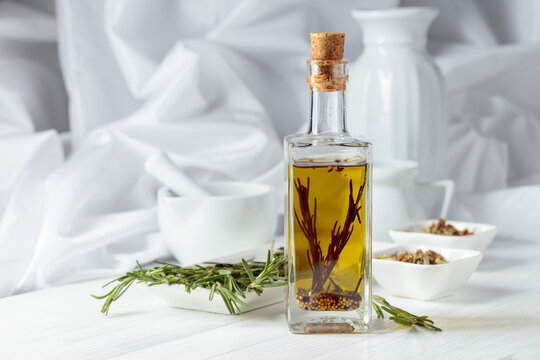 Olive oil with rosemary and spices.