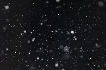 Snow on a black background. Snowflakes for overlay. Snow background.