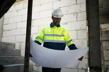 Architect and construction engineer or surveyor discussion plans and blueprints
