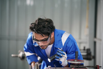 Workers changing and repair part of wheels at the car service