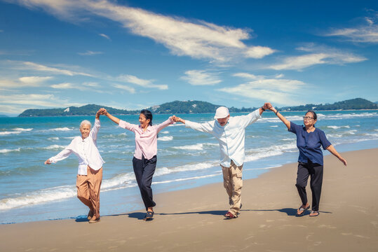 Group Of Asian Seniors Man And Women Happy Time On The Beach