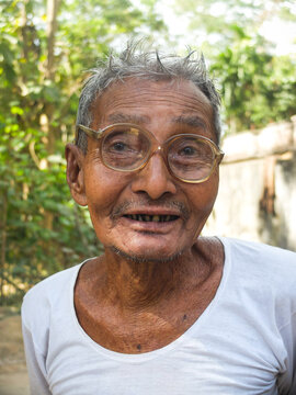 Close Up Portrait Of South Asian Aged Grandfather 