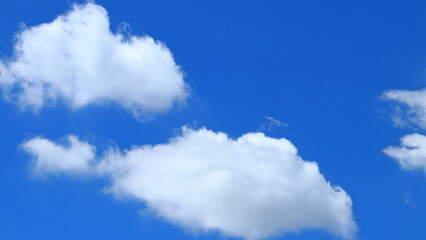 white clouds on a bright sky background in the evening