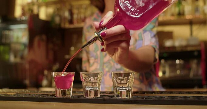 Bartender making drinks in warm bar