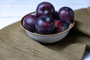 Red plums in bowl, red plum concept idea photos.
