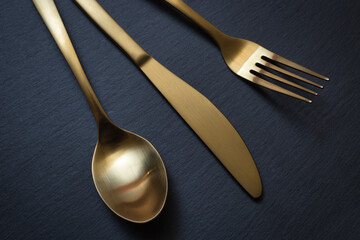 Golden spoon, knife and fork - 523602218