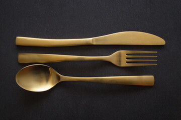 Golden spoon, knife and fork - 523602219