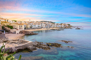 The whitewashed fishing village of Calella de Palafrugell along the sandy and rocky coastline of...