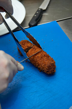 Meat Cutlet Roll Stuffed With Mozzarella Cheese And Mushrooms In Breadcrumbs Cooking Stage Fryer Boiling.