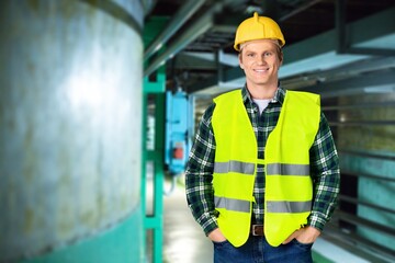 Portrait of factory worker or contractor in petrochemical industrial refinery.