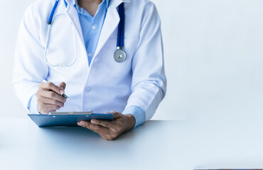 Online medical consultation doctor working on laptop computer in clinic office, healthcare, medical service, consultation or education, healthy lifestyle concept