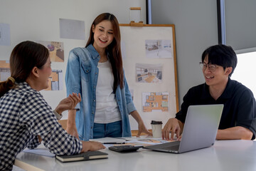 Obraz premium Architect design works drawing sketches, plans, blueprints and building architectural construction models in an architect studio.