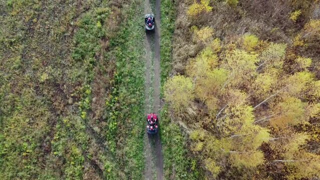 Flying over ATV drivers flat, aerial photography from a quadcopter, background field and forest