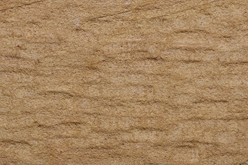 Yellow sandy natural stone of yellow color. Rough natural stone.