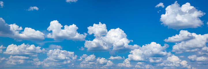 Naklejka na ściany i meble Texture of white clouds on a blue sky, panorama. Cloudy sky, banner