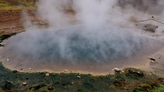geyser in Iceland. fumarole geothermal area in Iceland. geothermal iceland geyser. steam comes from geothermal geyser in iceland. slow motion