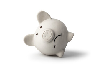 A sad piggy bank isolated on white background, symbolizing the fall of monetary assets. White...