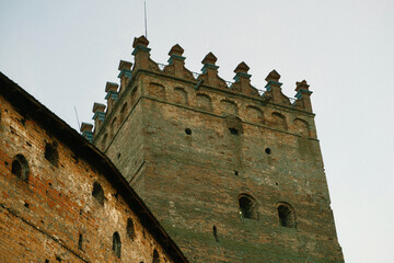 Walls and tower of an ancient castle. Brick walls and watchtower of an ancient castle. History -...