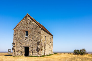 Fototapeta premium The Chapel of St Peter-on-the-Wall, Bradwell-on-Sea, Essex, is a Grade I listed building and among the oldest largely intact Christian churches in England; it is still in regular use. 