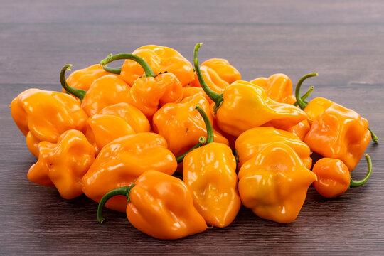 Bunch of Yellow Habaneros or Scotch Bonnet Peppers Closeup