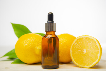Lemon essential oil on a white isolated background. Selective focus. Food.