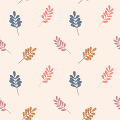 Seamless autumn pattern of ashberry leaves on a beige background in warm palette.  For textile, wrapper, background.
