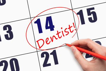 14th day of the month.  Hand writing text DENTIST and circling the calendar date.