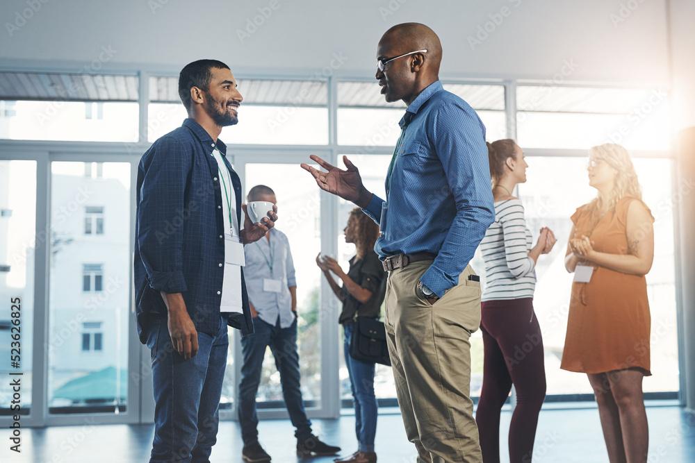 Aufkleber Creative men talking at networking event, sharing startup ideas and discussing new innovation at business conference. Diverse group of people meeting, collaborating or having a conversation in office