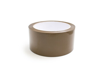 A roll of brown adhesive tape lies on a white background. A stationery item in the form of sticky...