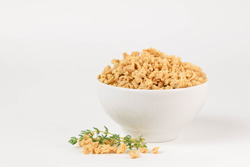 Textured soy protein or soy meat in a white bowl isolated on white background