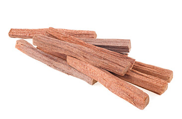 Pile of sandalwood sticks isolated on a white background