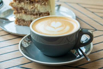 Cup of cappuccino and sweet cake