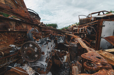 Fototapeta na wymiar Cemetery of rusted and burned disposed cars