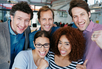 Fun, cheerful and casual business people celebrating in an office together. Portrait happy colleagues collaborating on startup, united, ambitious and confident. Workers with vision, plan or strategy