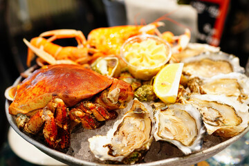 Plateau de fruits de mer or seafood platter, a restaurant in Port en Bessin, Normandy, France 
