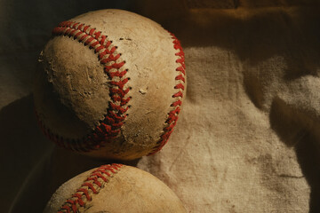 Old used baseball ball with rough vintage style and copy space on background.
