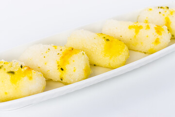 Indian sweet food Long Rasgulla Also Know as Rosogolla, Roshogolla, Rasagola, Ras Gulla, Anguri Rasgulla or Angoori Rasgulla a Dessert Popular in India, isolated on white background