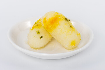 Indian sweet desert Long Rasgulla Also Know as Rosogolla, Roshogolla, Rasagola, Ras Gulla, Anguri Rasgulla or Angoori Rasgulla a Dessert Popular in India food isolated on white background