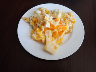 scrabbled eggs with vegetales served on a plate