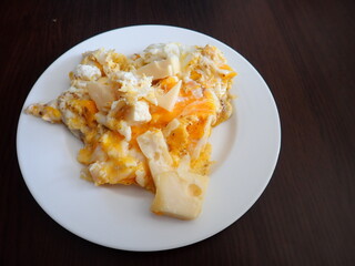 scrabbled eggs with vegetales served on a plate