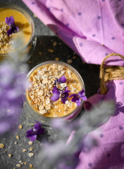Smoothie with purple flower and oats