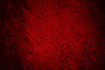 Black red wall. Grunge background for design. Toned old rusty rough grainy metal surface.
